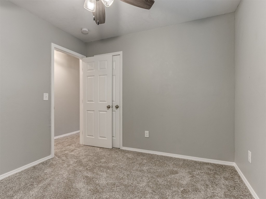 608 SW 26th Street, El Reno, OK 73036 carpeted spare room with a ceiling fan