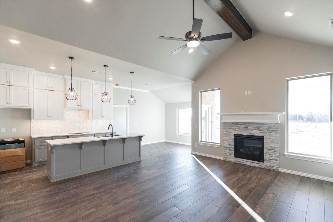 This Blue Spruce floor plan features 2,185 Sqft of total living space, which includes 1,900 Sqft of indoor living & 285 Sqft of outdoor living. This exception Taber home offers 4 bedrooms, 2 bathrooms, 2 covered patios, a utility room, & a 3 car garage w/ a storm shelter installed because, at Homes by Taber, safety is not an option. The well-curated great room presents a well-crafted cathedral ceiling, a gas fireplace w/ our stacked stone surround detail, large windows, elegant crown molding, wood-look tile, Cat6 wiring, & a barn door. The high-end kitchen boasts custom-built cabinets to the ceiling, stunning pendant lighting, a center island, stainless steel appliances, 3 CM countertops, a walk-in pantry, & more wood-look tile. Prime suite is tucked away & features a sloped ceiling w/ a ceiling fan, windows, & our cozy carpet finish. Prime bath has a dual sink vanity, a Jetta Whirlpool tub, a private water closet, a walk-in shower, & a HUGE walk-in closet. Outdoor living supports a wood-burning fireplace, a gas line, & a TV hook up. Other amenities for this home include our healthy home technology, an air filtration system, a tankless water heater for endless hot water, R-44 & R-15 insulation, & so much more!