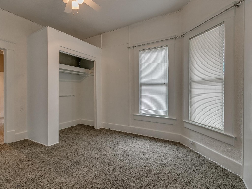 717 N Market Avenue, Shawnee, OK 74801 bedroom featuring carpet and a ceiling fan