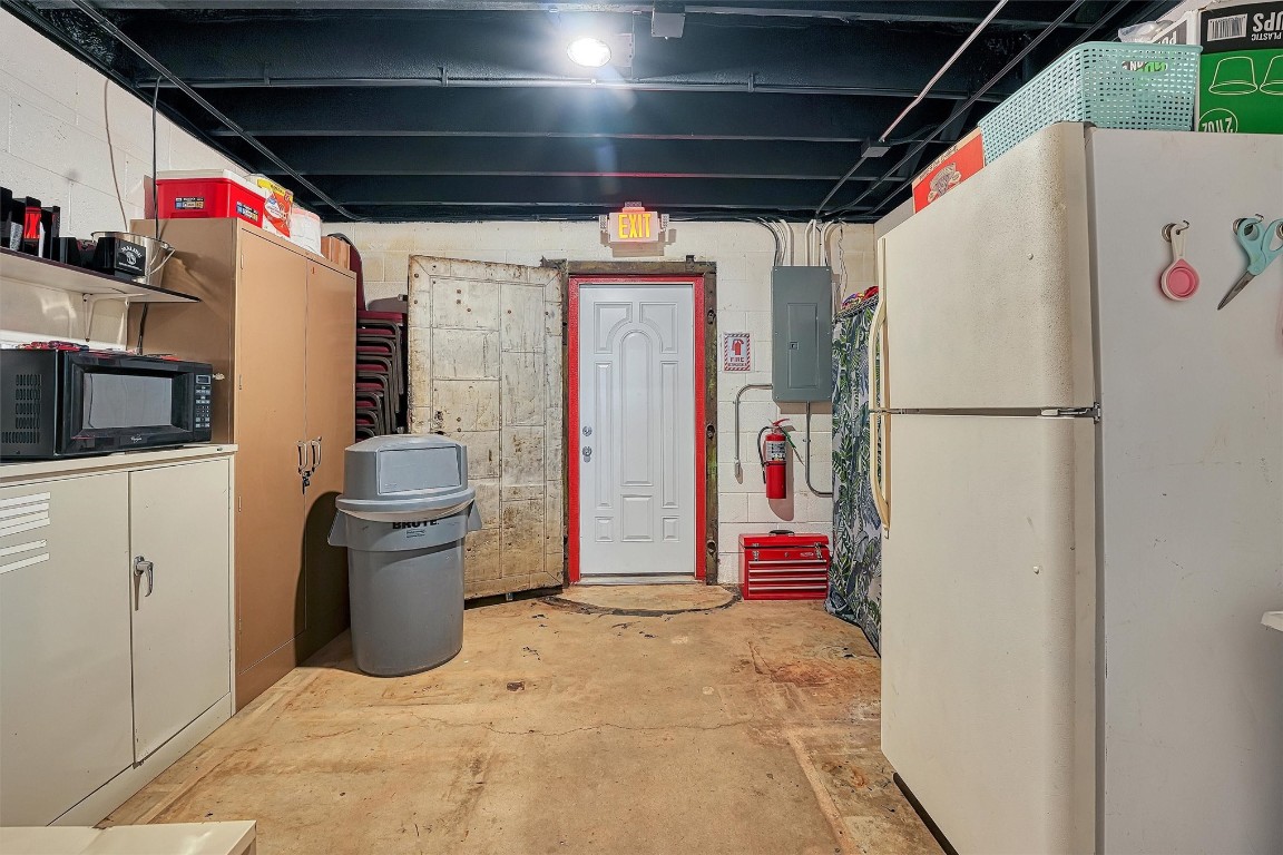 514 N Van Buren, Elk City, OK 73644 basement with white refrigerator