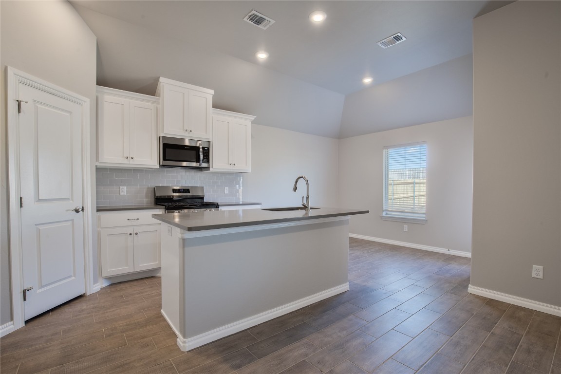 This Tero floor plan includes 1,680 Sq Ft of total living space, which includes 1,565 Sq Ft of indoor living space and 115 Sq Ft of outdoor living space. There's also a 385 Sq Ft, 2-car garage w/ a storm shelter installed. This affordable home offers 4 bedrooms, 2 full baths, covered patios, & a utility room. Pass the covered front porch, and through the upgraded glass front door lies real estate heaven. Great room welcomes large windows, wood-look tile, a ceiling fan, & Cat6 wiring. Kitchen has 3 CM quartz countertops, stainless-steel appliances, wood-look tile, well-crafted cabinets w/ decorative hardware, a center island, & stylish tile backsplash. Primary suite is straight ahead & supports carpet flooring, a ceiling fan, & the perfect sized windows. Primary bath suits a dual sink vanity w/ an elegant countertop selection, a walk-in shower, an elongated water saving toilet, & a HUGE walk-in closet! Outdoor living is covered & has fully sodded yards w/ smart home irrigation control. Other amenities include a tankless water heater, a fresh air intake system, & MORE!