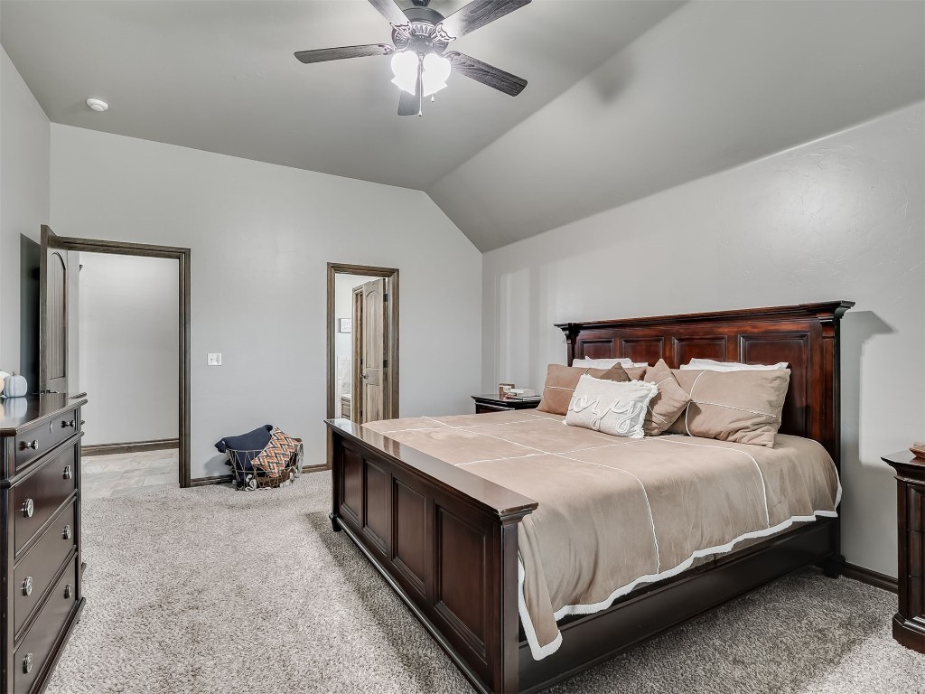1123 S Czech Hall Road, Tuttle, OK 73089 carpeted bedroom featuring lofted ceiling and ceiling fan
