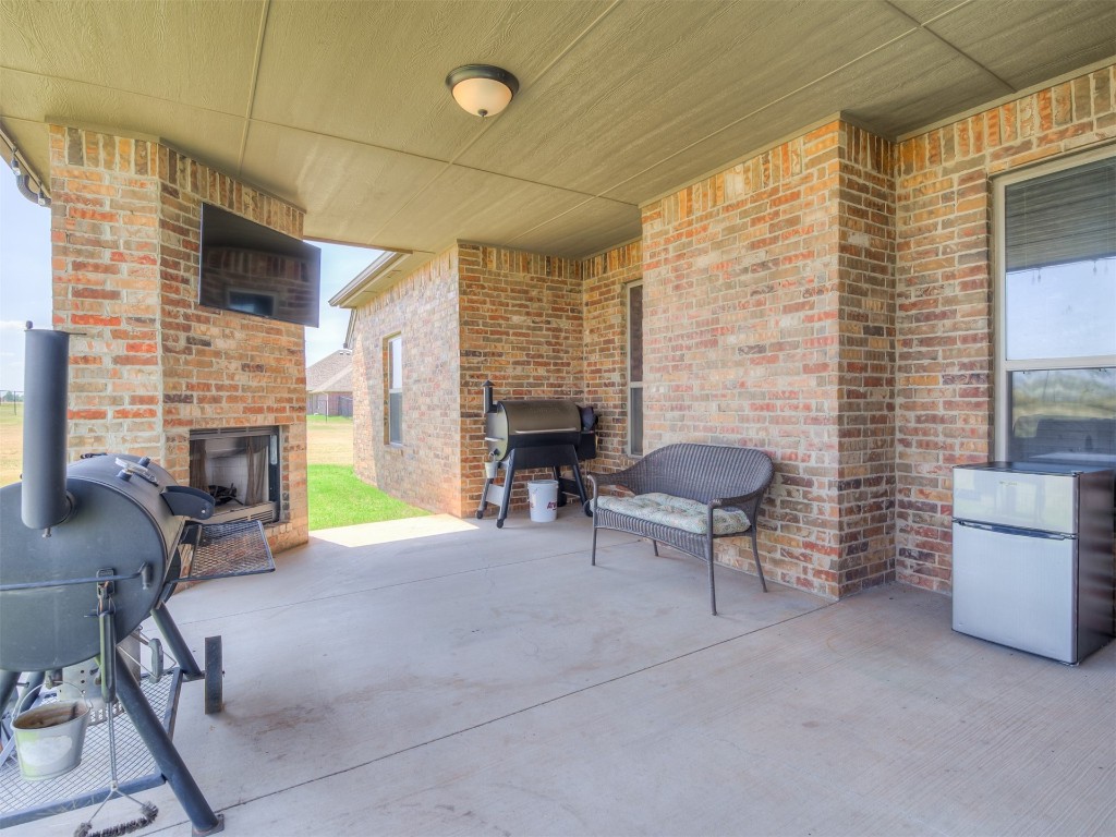 1123 S Czech Hall Road, Tuttle, OK 73089 view of patio / terrace with an outdoor fireplace