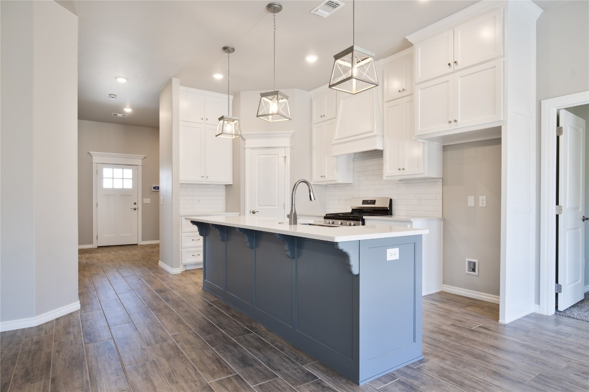 This Dane floor plan features 1,830 Sqft of total living space, which includes 1,700 Sqft of indoor space & 130 Sq Ft of outdoor living. Home offers 4 bedrooms, 2 full baths, 2 covered patios, a utility room, & a 2 car garage w/ a storm shelter installed! Living room welcomes a center gas fireplace w/ our stacked stone surround detail, large windows, a ceiling fan, & wood-look tile. The kitchen supports custom-built cabinets to the ceiling, stunning pendant lighting, UPGRADED COUNTERTOPS, a center island, a large corner pantry, & stainless steel appliances. Primary suite has a sloped ceiling detail, a ceiling fan, our cozy carpet finish, & windows. The attached bath features a dual sink vanity, a Jetta Whirlpool tub, a private elongated toilet, a walk-in shower, & a HUGE walk-in closet. Covered outdoor living area offers a wood-burning fireplace, a gas line, & a TV hookup. Other amenities include our healthy home technology, a tankless water heater, R-44 insulation, a whole home air purification system, & MORE!