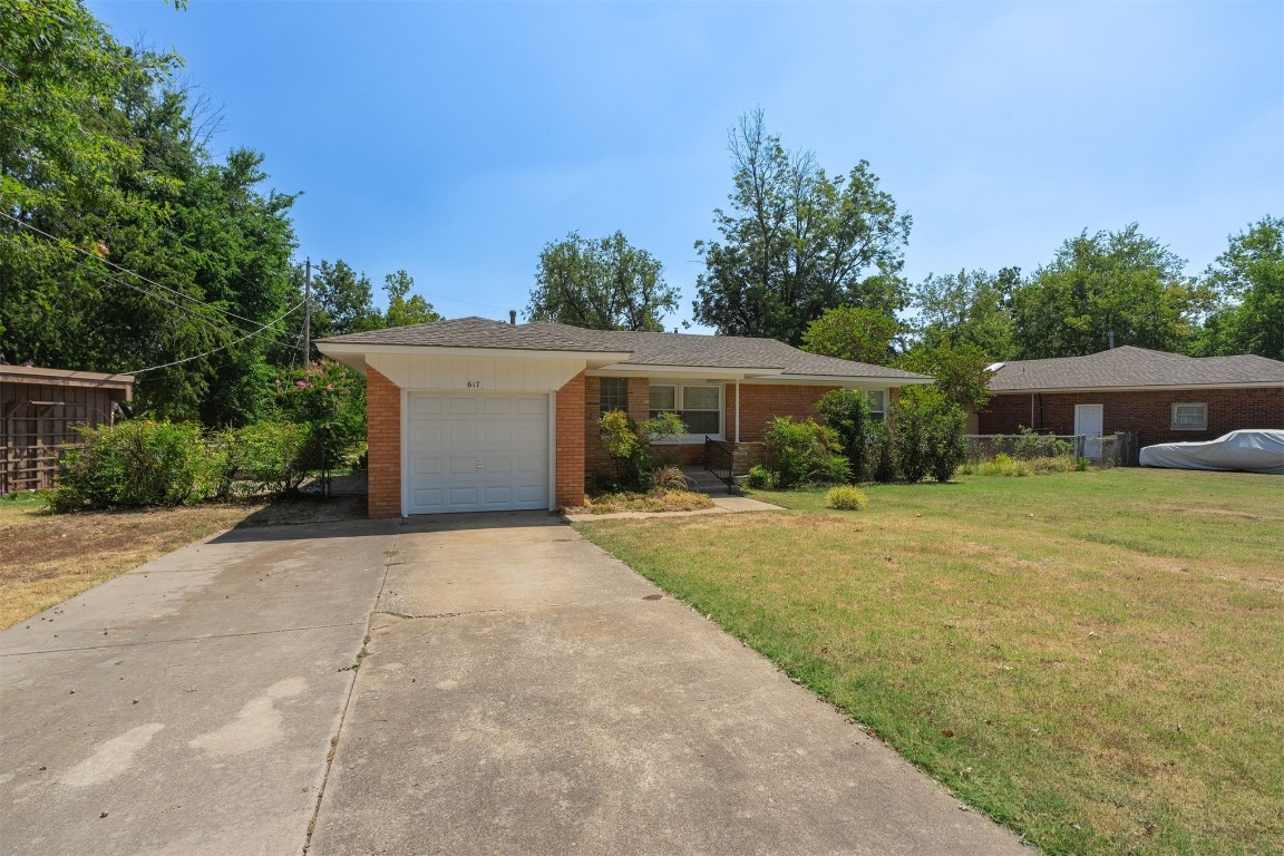 The savvy buyer won’t miss this one! This mid-century ranch style home is an exceptional value, yours to capitalize on, in this quiet Norman neighborhood close to the University of Oklahoma. Top-notch location. Quintessential mid-mod exterior with brick and stacked stone, front porch large enough for a bistro set and built-in planter. Groovy, slightly wide eaves and plenty of room to landscape. Inside, the vestibule with coat closet, opens to the living room with more mid-mod accents:  original wood built-in room divider with clean lines between living and dining. Right-sized breakfast bar and clean white kitchen cabinetry. Plenty of storage. The bones of this home are everything they should be. Pretty hardwoods poised to shine, kept safe beneath protective carpet. Two beds plus bonus room, could be third bed or create a primary suite. Great flow, flexible floorplan and original built-ins and bathroom tile. Very livable now and easily updated. It’s all there, waiting for your vision. Manageable yard with mature plantings. Storm cellar, new roof (2022) and HVAC (2021). Large backyard backs up to the park. Just one owner in the last 60 years, whose family filled it with memories. Now it’s ready for yours.