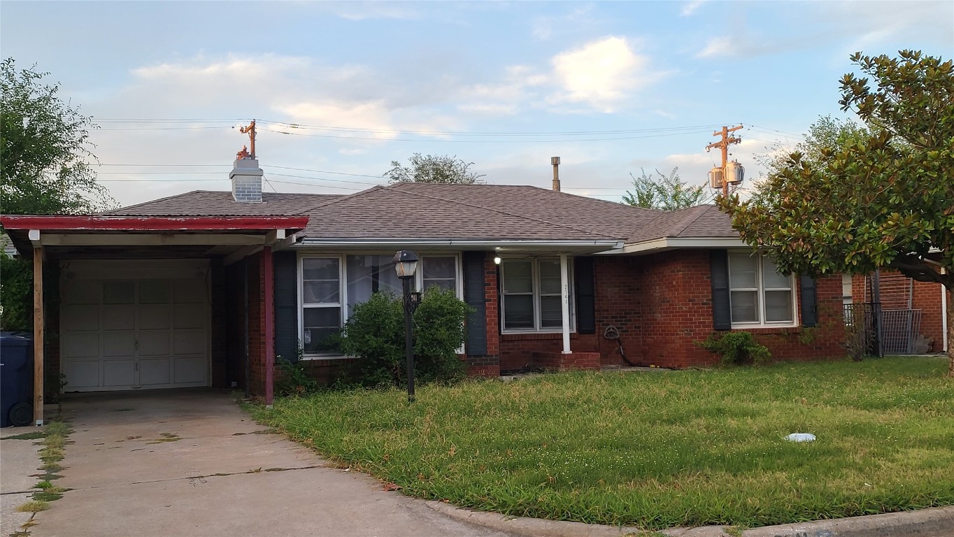 Cute brick home loaded with possibilities!  Nice size living room with big picture window, ceiling fan, and cozy corner fireplace.  This home has a screened in back porch with an over-sized patio door.  Needs TLC and selling as-is.  Come bring your vision to life!