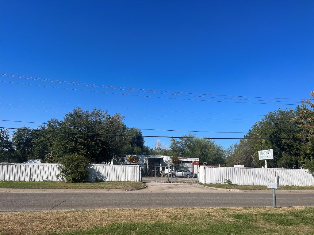 This property is currently used as a mechanics shop. Shop contains 3 bays with 2 lifts. The Shop and Land are Fenced with a Metal Fence all the way around the property, with 2 entrance points with gates.
