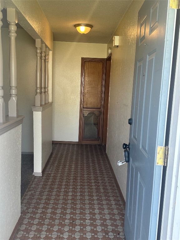 7804 S Charlotte Drive, Oklahoma City, OK 73159 corridor featuring dark tile floors