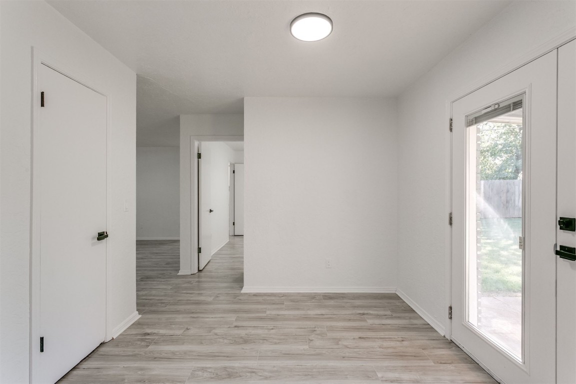 2600 SW 65th Street, Oklahoma City, OK 73159 spare room featuring light hardwood flooring