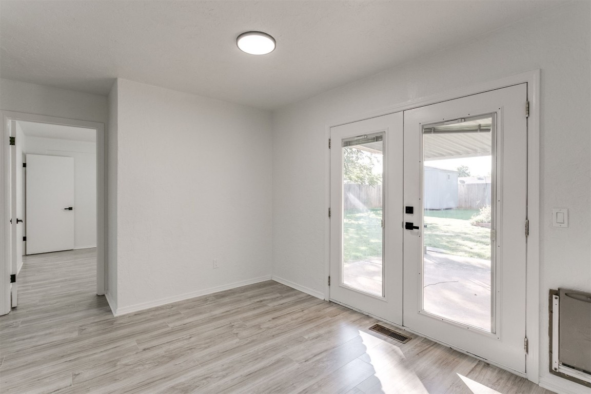 2600 SW 65th Street, Oklahoma City, OK 73159 doorway with light hardwood flooring