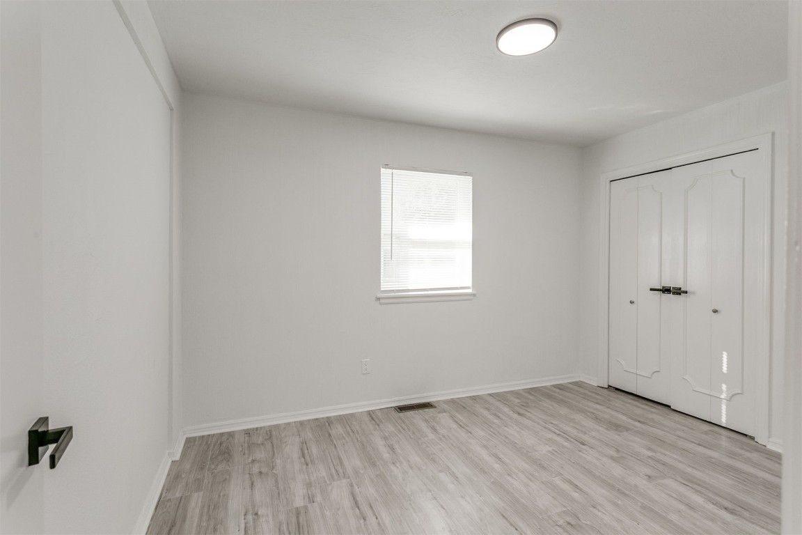 2600 SW 65th Street, Oklahoma City, OK 73159 view of hardwood floored bedroom
