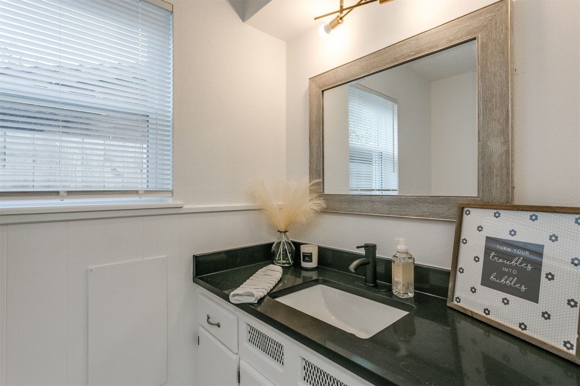 2600 SW 65th Street, Oklahoma City, OK 73159 bathroom featuring vanity and mirror