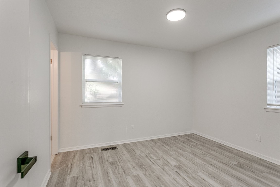 2600 SW 65th Street, Oklahoma City, OK 73159 unfurnished room with light hardwood flooring