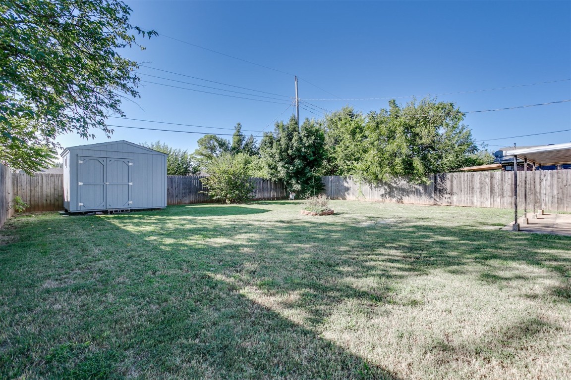 2600 SW 65th Street, Oklahoma City, OK 73159 view of yard featuring a storage shed