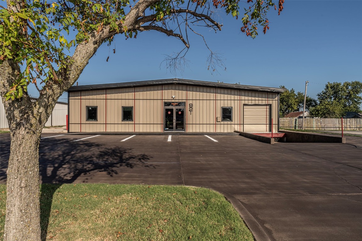 OFFICE/MANUFACTURING BUILDING: NEW PRICE - Retiring from a 45-year working commercial business - A spacious (4320 S.F.) all metal building with a recent enhanced facade, fresh paint & sealed dark grey concrete drive/walkway. 50% of the building is a remodeled urban office space & 50% manufacturing space. (Zoned O-1) Office area has a slate tile lobby, reception area with built-in desk, counter & cabinetry. There is a large sliding door that opens to a grand conference room with slate tile, a dropped illuminated ceiling, enough space for a seating area, conference table, coffee bar and more. Other rooms include: storage room, (2) bathrooms, (2) large office spaces, meeting room, kitchen & copy/print room. Woodwork is black/white-wash oak doors, cabinetry & trim. The multi-line telephone system will stay with the building. There are (5) HVAC units. (3 operating & 2 disconnected to conserve power) the roof is metal. The other 50% is a Manufacturing space that has high ceilings, (2) more bathrooms/used as storage now but can be restored to operating toilets. Drive-in dock with an 8' x 10' door. The Manufacturing area has built-in racks & workstations & a steel exterior door. This space is versatile. There are (10) parking spaces & a handicapped-accessible ramp. The business and equipment are for sale. Seller would consider carrying the mortgage with a minimum of 25% down for a qualifying Buyer. Leasing is also possible. See the attachments for the disclosure, floorplan, inventory list of equipment for sale & zoning details. This is a great opportunity to improve your existing business or launch a new one. 
This is a working company so please be CONFIDENTIAL. 
No drop-ins, by appointment only.