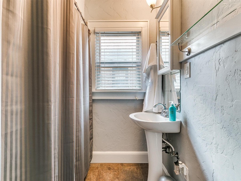 2509 W Park Place, Oklahoma City, OK 73107 bathroom with tile floors and sink