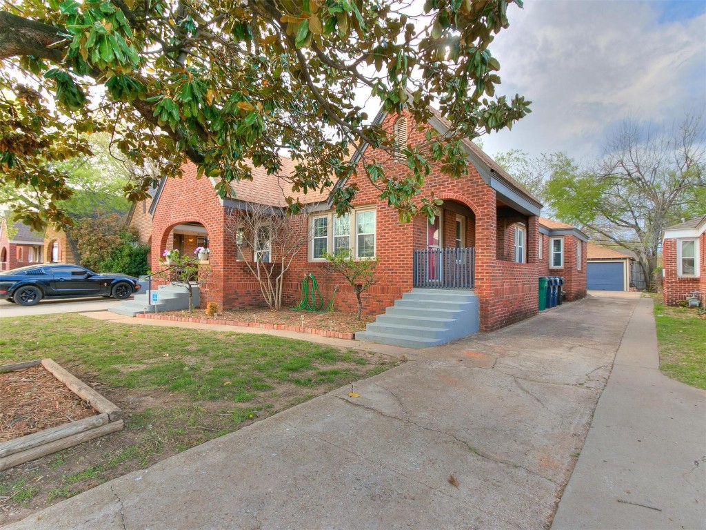 2509 W Park Place, Oklahoma City, OK 73107 tudor-style house with a garage