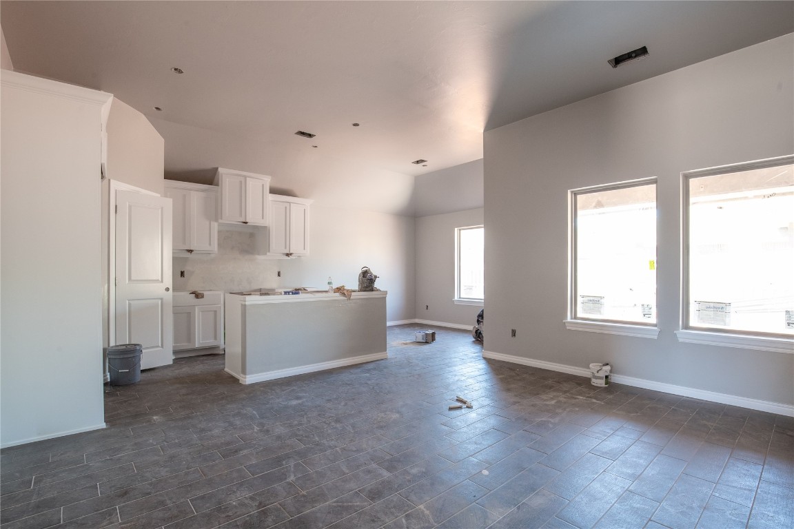 Our Allen floor plan includes 1,765 Sqft of total living space, which includes 1,650 Sqft of indoor living space & 115 Sqft of outdoor living space. There's also a 385 Sqft, two car garage with a storm shelter installed. A storm shelter is included in every Taber home and sits 6-8 adults. This home offers 4 bedrooms, 2 full baths, an office, covered patios, & a utility room. The living room welcomes large windows, wood-look tile, a ceiling fan, & Cat6 wiring. The kitchen features 3 CM quartz countertops, stainless steel appliances, wood-look tile, well-crafted cabinets with decorative hardware, a center island, & stylish tile backsplash. The lovely primary suite is straight ahead & supports carpet flooring, a ceiling fan, & the perfect sized windows. The sizeable primary bath suits a dual sink vanity with an elegant quartz countertop, a walk-in shower, an elongated water saving toilet, & a huge walk-in closet! Outdoor living is covered & has fully sodded yards with smart home irrigation control. Other amenities include a tankless water heater, a fresh air intake system, an air filtration system, R-15 and R-15 insulation, double glazed low-e windows with argon, & so much MORE!