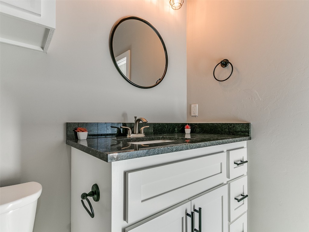 117 W Duane Drive, Mustang, OK 73064 bathroom featuring toilet and vanity