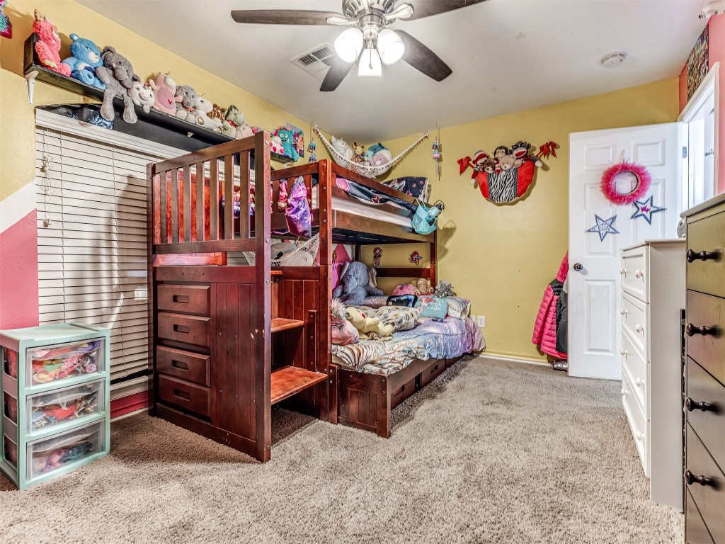 4205 Red Apple Terrace, Moore, OK 73160 carpeted bedroom with ceiling fan