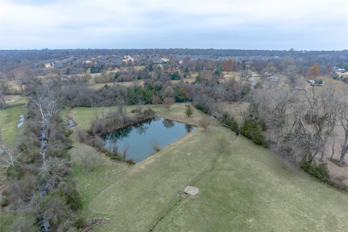 715 Edgewood Drive, Choctaw, OK 73020 drone / aerial view featuring a water view and a rural view
