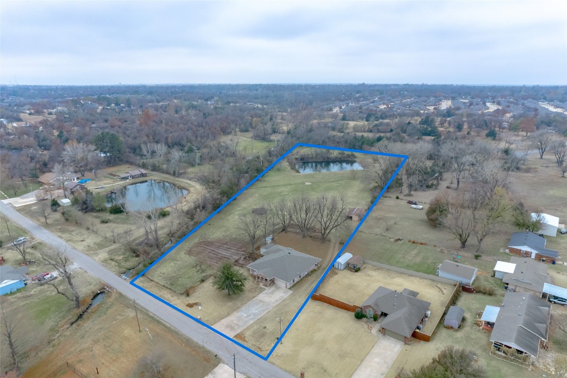 715 Edgewood Drive, Choctaw, OK 73020 drone / aerial view featuring a water view