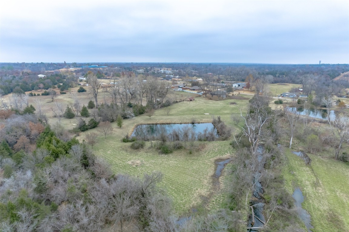 715 Edgewood Drive, Choctaw, OK 73020 drone / aerial view with a water view and a rural view
