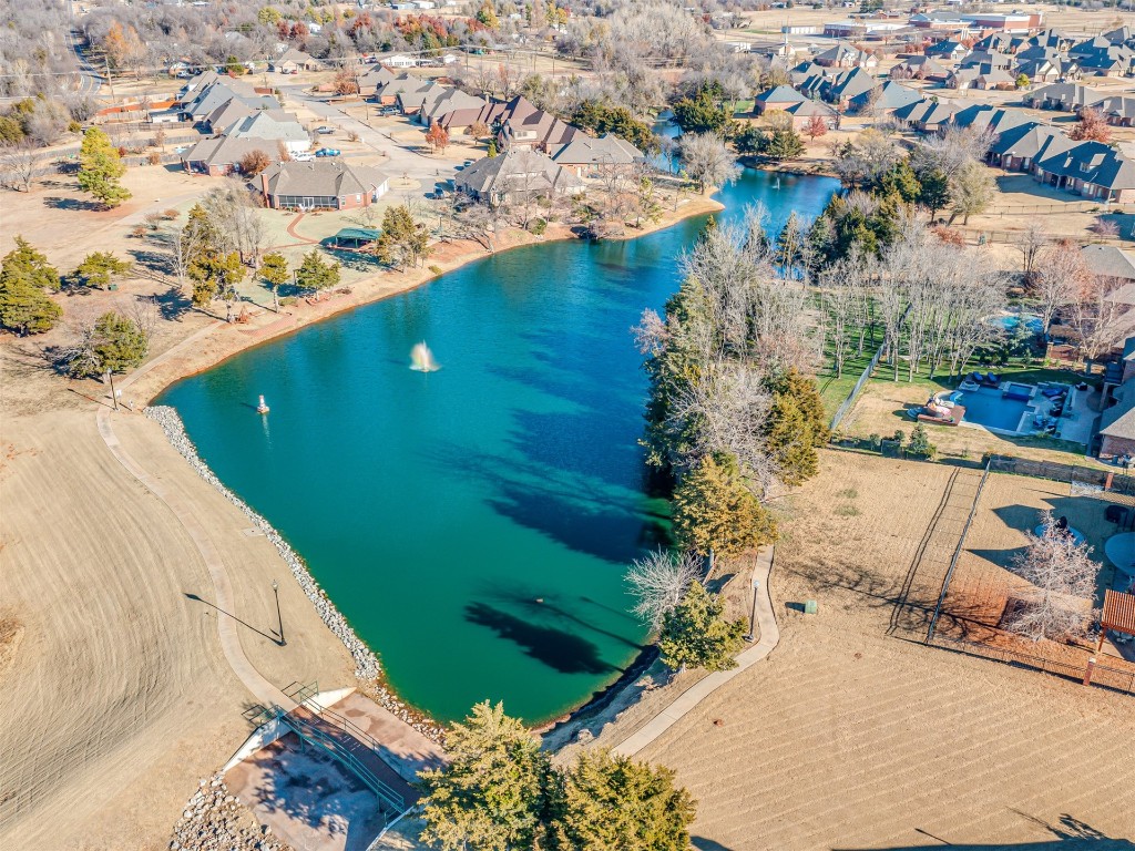 2317 W Mickey Drive, Mustang, OK 73064 drone / aerial view featuring a water view