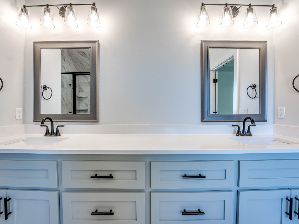 124 W Lynn Court Drive, Mustang, OK 73064 bathroom featuring dual bowl vanity