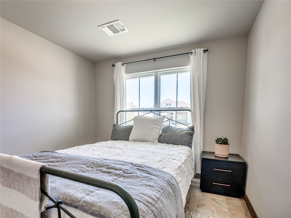 10517 NW 33rd Street, Yukon, OK 73099 bedroom with light parquet floors