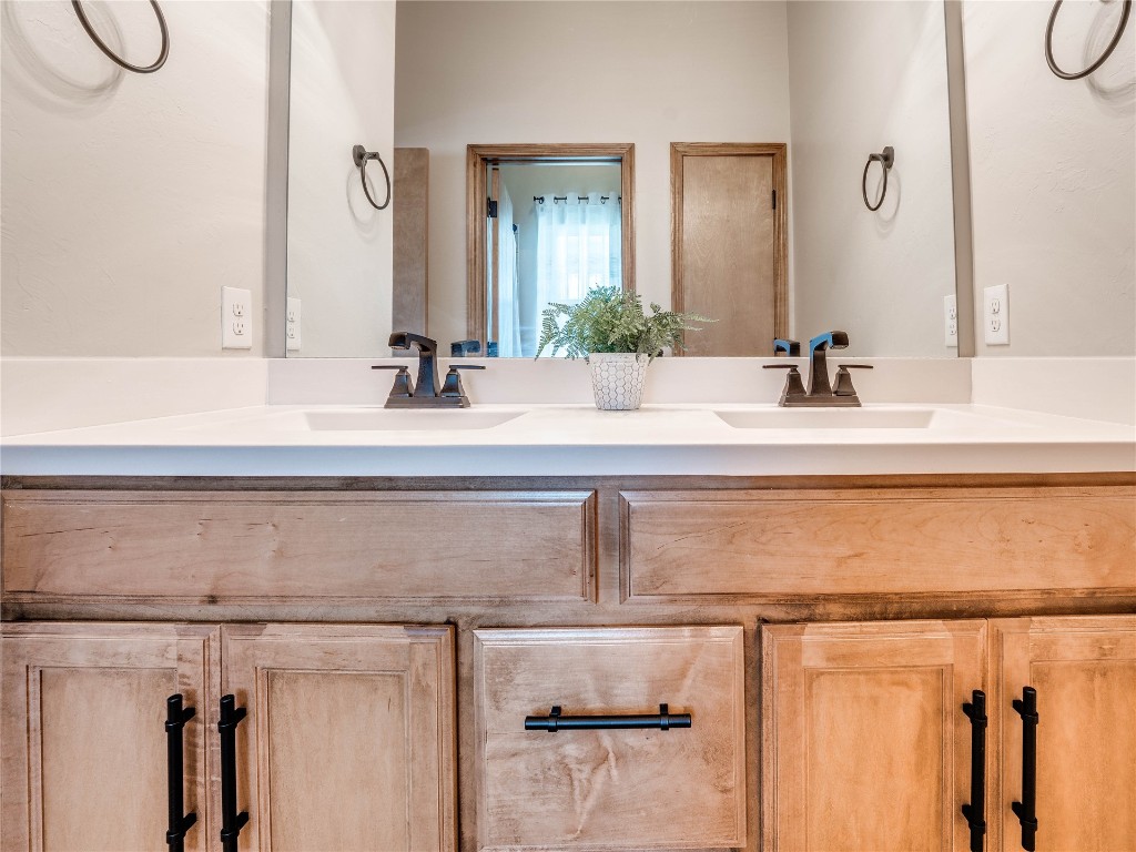 10517 NW 33rd Street, Yukon, OK 73099 bathroom featuring double sink vanity