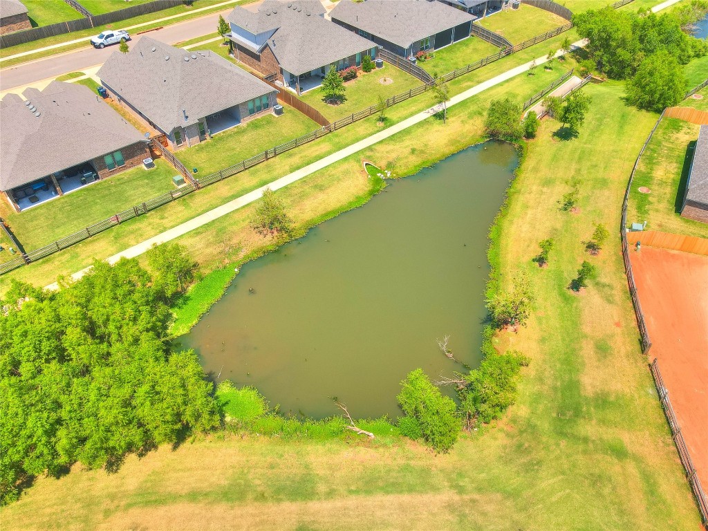 10517 NW 33rd Street, Yukon, OK 73099 drone / aerial view with a water view