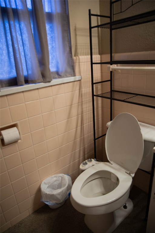 107 Cimarron Road, Burns Flat, OK 73647 bathroom with tile walls and toilet