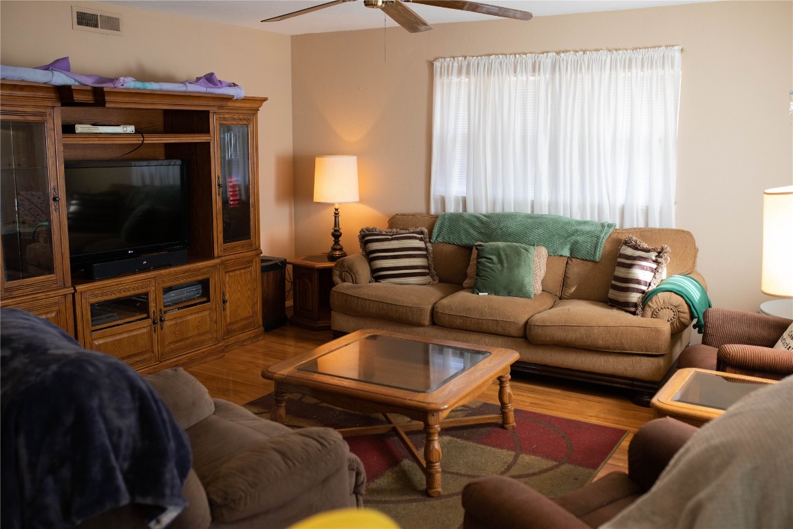 107 Cimarron Road, Burns Flat, OK 73647 living room with light hardwood / wood-style flooring and ceiling fan
