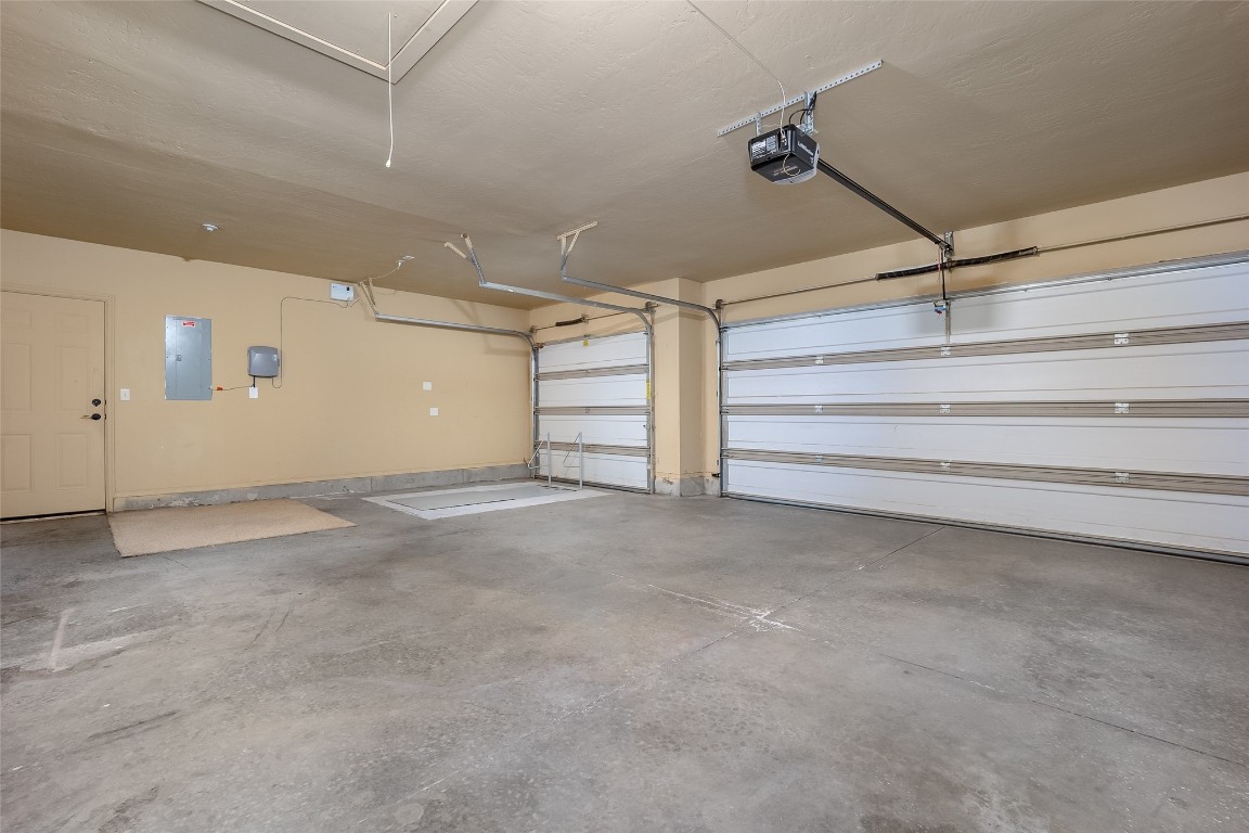 8509 NW 111th Street, Oklahoma City, OK 73162 garage featuring a garage door opener