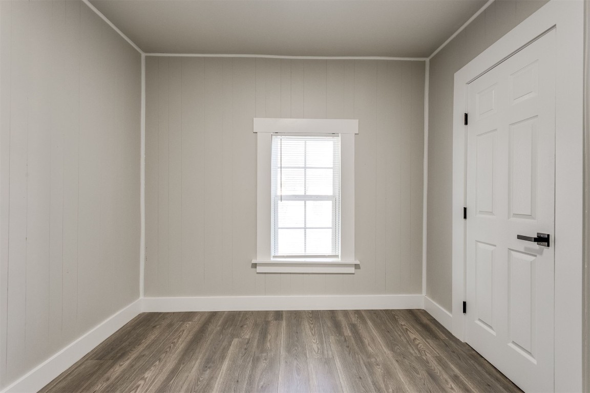 735 NW 90th Street, Oklahoma City, OK 73114 unfurnished room featuring dark hardwood / wood-style floors