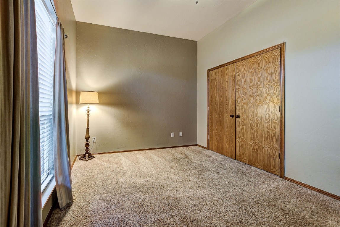 1304 Polly Way, Mustang, OK 73064 unfurnished bedroom featuring carpet and a closet