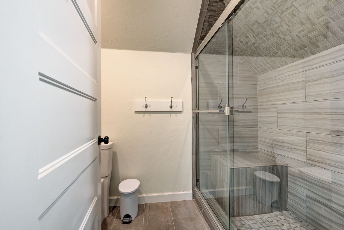 1304 Polly Way, Mustang, OK 73064 bathroom with an enclosed shower