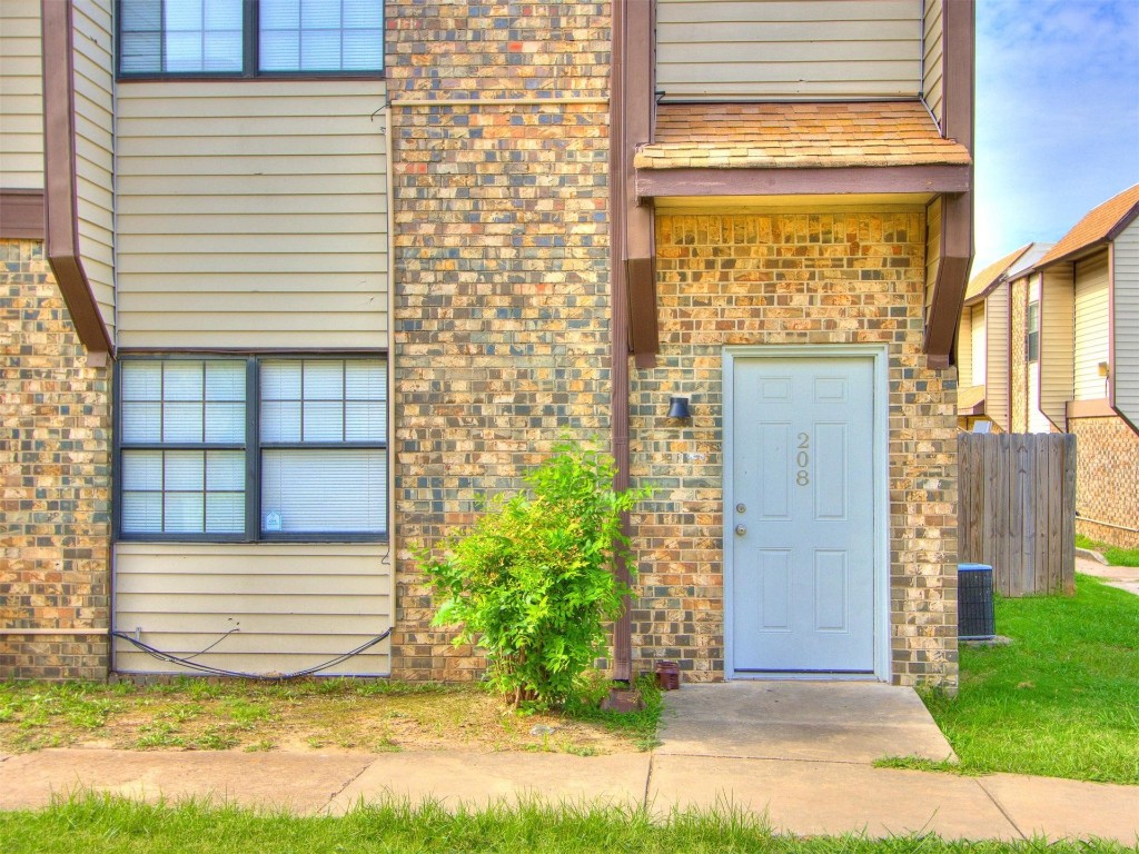 401 SE 12th Avenue, #208, Norman, OK 73071 property entrance with central air condition unit