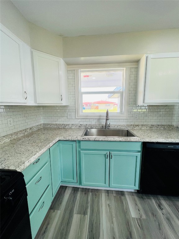 113 Osage Road, #B, Burns Flat, OK 73647 kitchen with dishwasher, sink, white cabinets, backsplash, and light hardwood / wood-style flooring