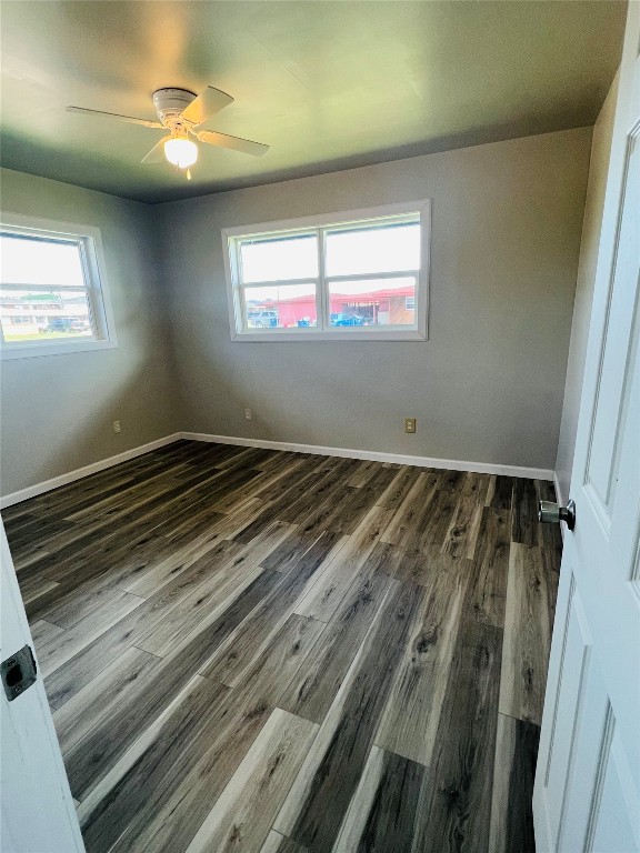 113 Osage Road, #B, Burns Flat, OK 73647 empty room with dark hardwood / wood-style flooring and ceiling fan