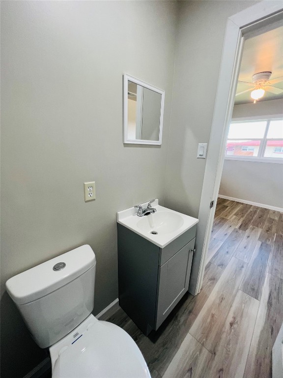 113 Osage Road, #B, Burns Flat, OK 73647 bathroom featuring toilet, oversized vanity, and wood-type flooring