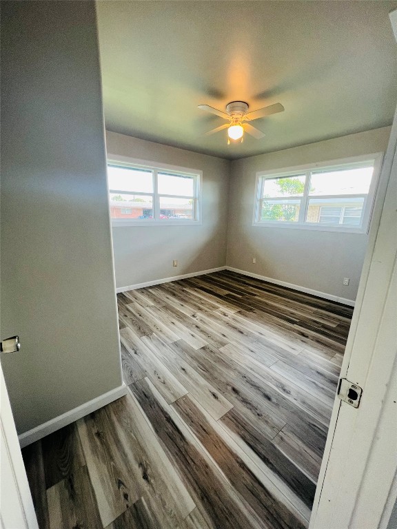 113 Osage Road, #B, Burns Flat, OK 73647 unfurnished room featuring ceiling fan and hardwood / wood-style floors