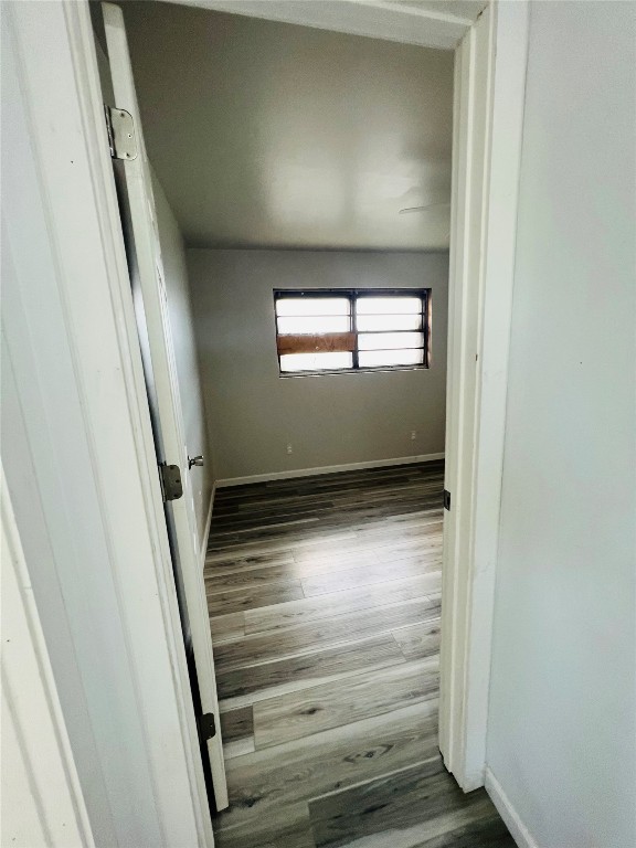 113 Osage Road, #B, Burns Flat, OK 73647 spare room with dark wood-type flooring