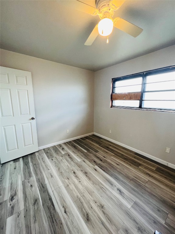 113 Osage Road, #B, Burns Flat, OK 73647 empty room with ceiling fan and wood-type flooring