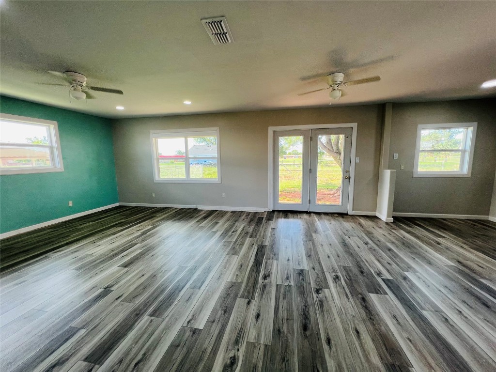 113 Osage Road, #B, Burns Flat, OK 73647 unfurnished room featuring ceiling fan and wood-type flooring