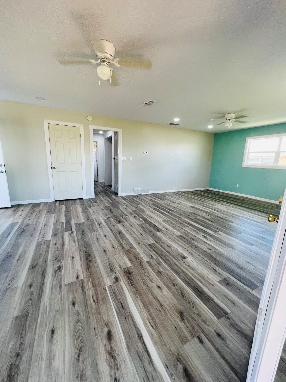 113 Osage Road, #B, Burns Flat, OK 73647 spare room featuring ceiling fan and hardwood / wood-style floors