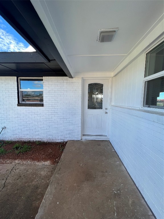 113 Osage Road, #B, Burns Flat, OK 73647 doorway to property with a patio area