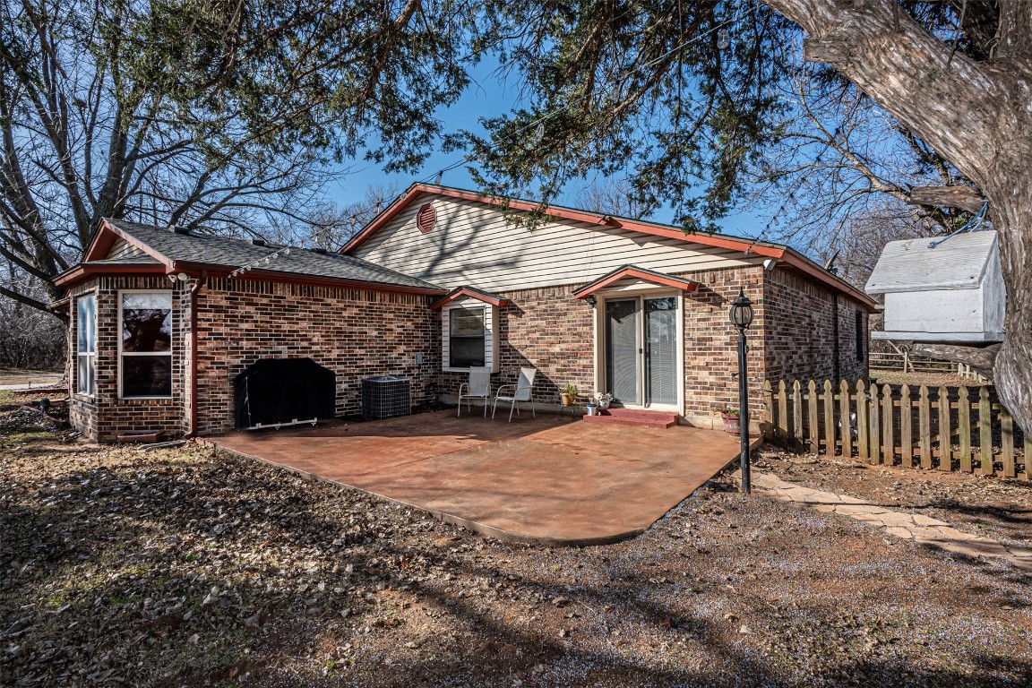 3735 Janet Circle, Mustang, OK 73064 rear view of house with a patio area and central AC unit