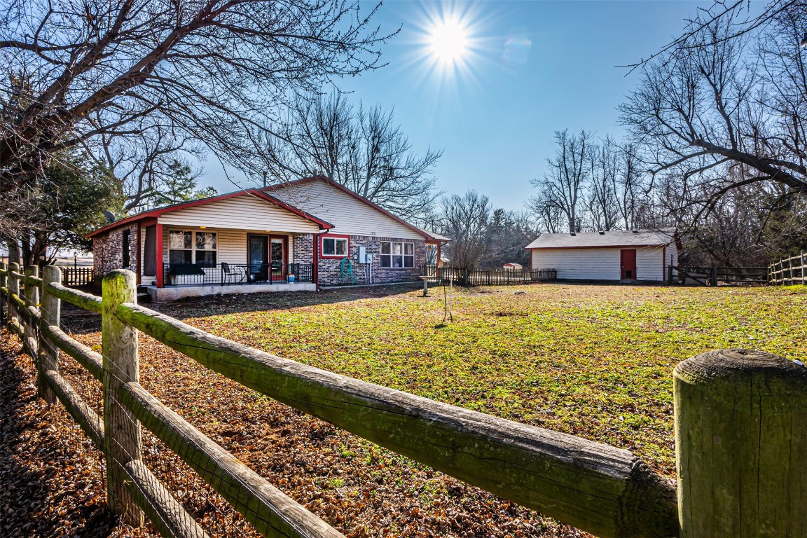 3735 Janet Circle, Mustang, OK 73064 exterior space with covered porch and a lawn